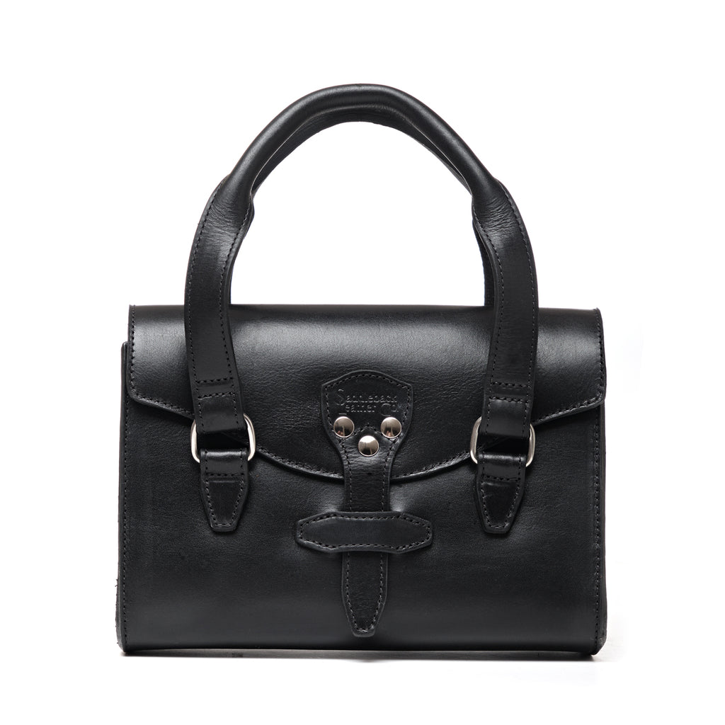 Double Handle Purse in Raven Black, front view with twin top handles and latched front flap