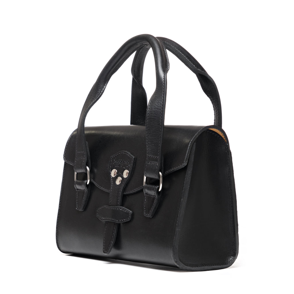 Double Handle Purse in Raven Black, angled front view with twin handles and latched front flap