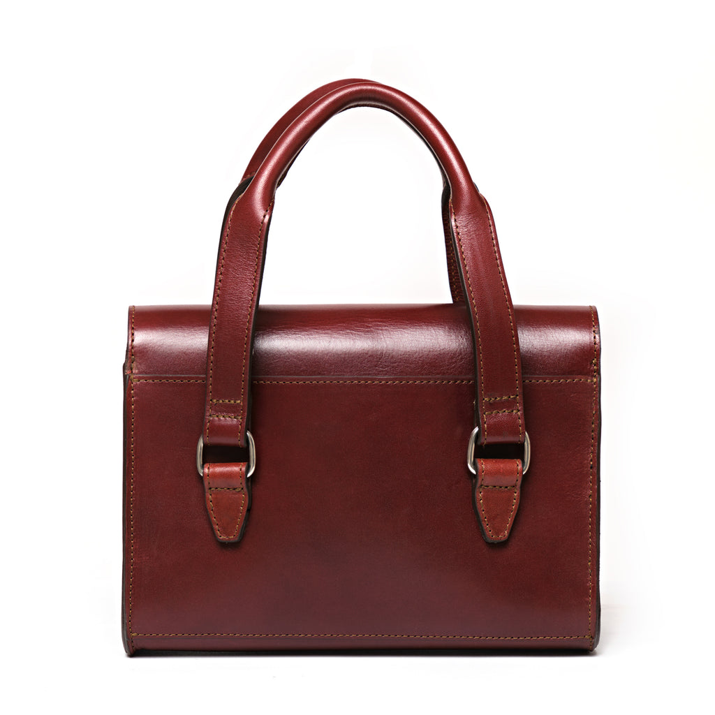 Double Handle Purse in Oxblood, back view showing the handle straps and buckles