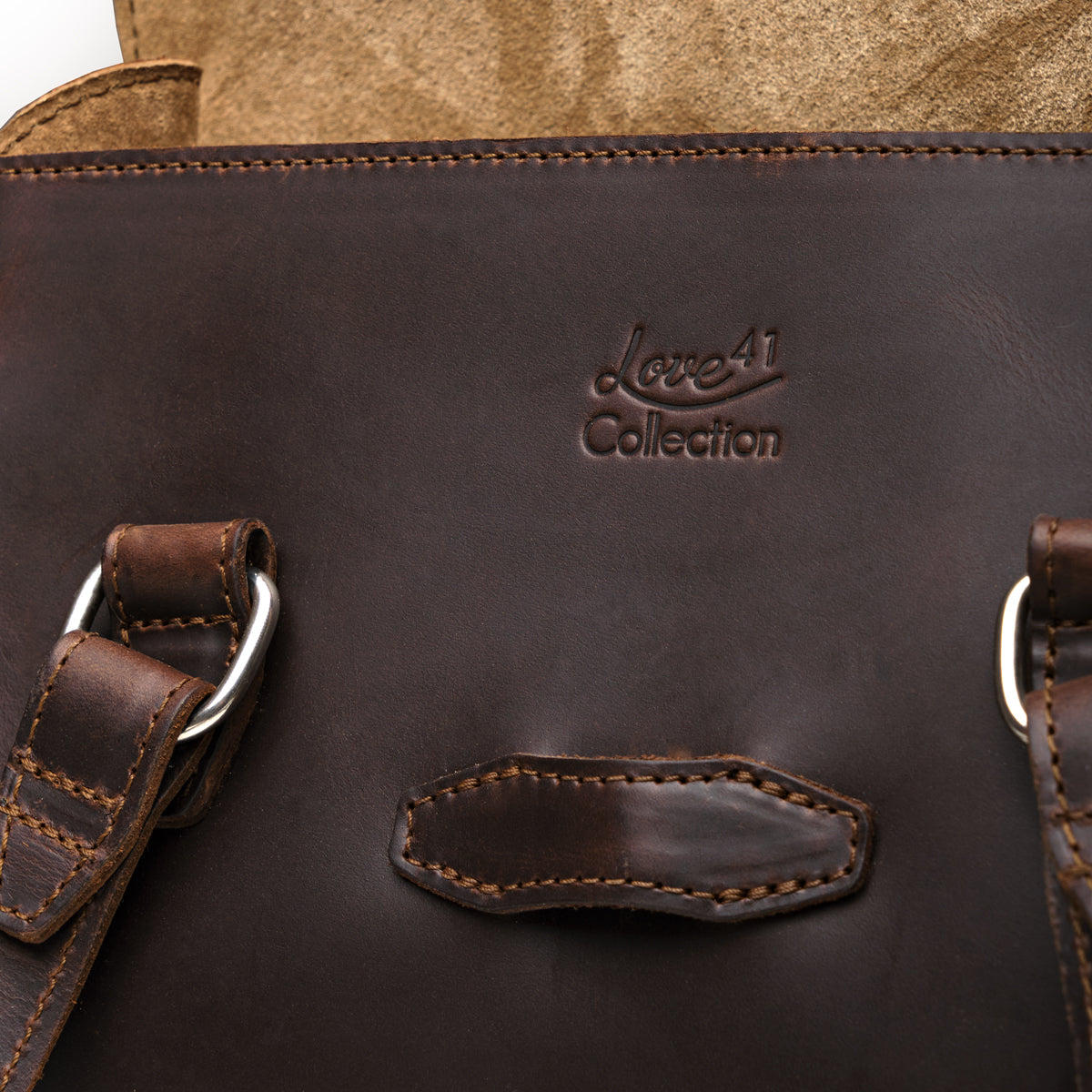 Double Handle Purse in Dark Coffee Brown, close-up of the embossed Love 41 Collection logo and stitched tab