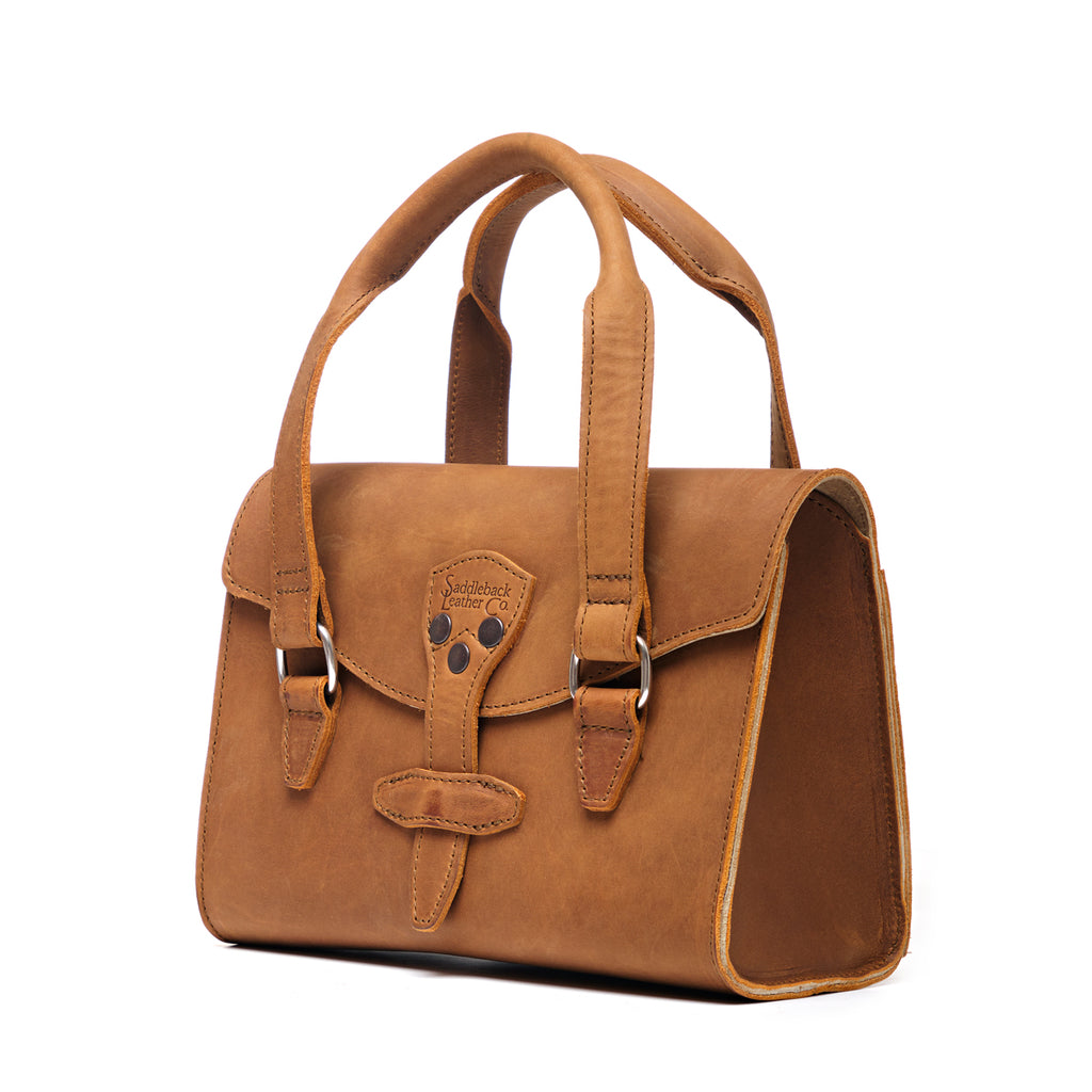 Double Handle Purse in Tobacco, angled side view showing the gusset and flap closure