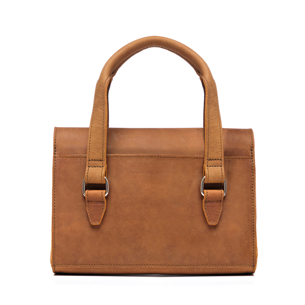 Double Handle Purse in Tobacco, back view with twin top handles and buckle tabs