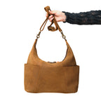 Women's Hobo Organizer Bag in Tobacco, held up by its shoulder strap showing the front pockets