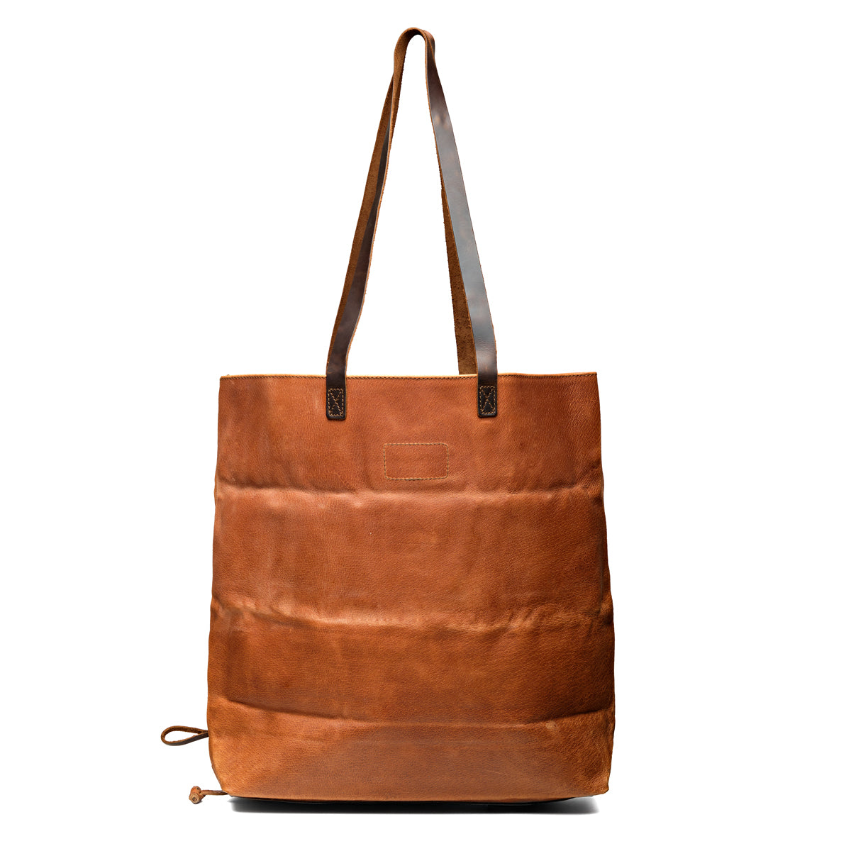 Travel Tote in Bacon, back view with ridged hogsback leather and two dark shoulder handles