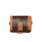 Travel Tote in Bacon, rolled up for packing and secured with its leather strap and D-ring