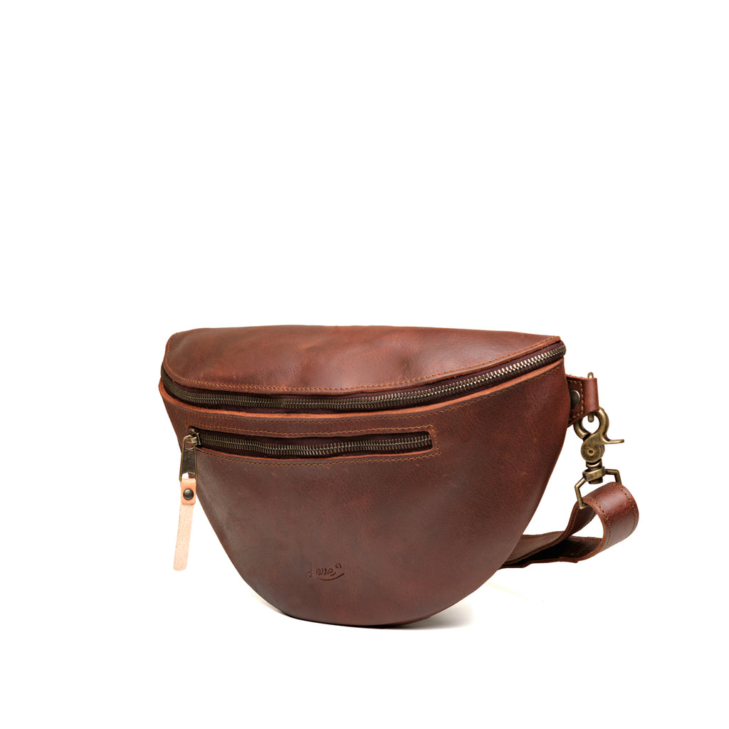 Leather Tumbled Fanny Bag in Chestnut, angled side view showing the zippered front pocket