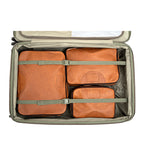 Pigskin Leather Packing Cube Set, three cubes packed and strapped inside an open rolling suitcase