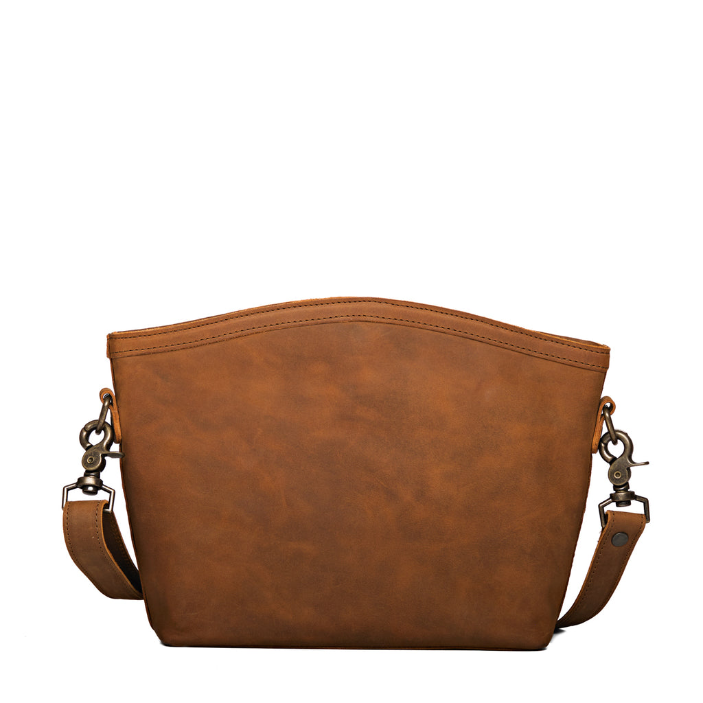 Lanita Medium Crossbody in Tobacco, back view of plain leather side with strap clips