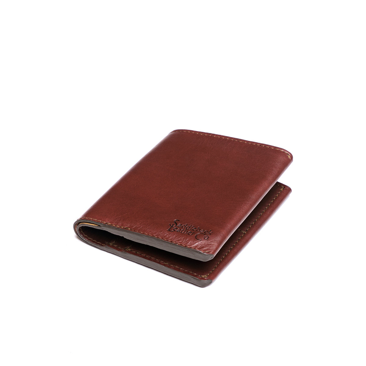 Large Bifold Wallet in Chestnut, closed and angled showing the stitched spine and embossed logo