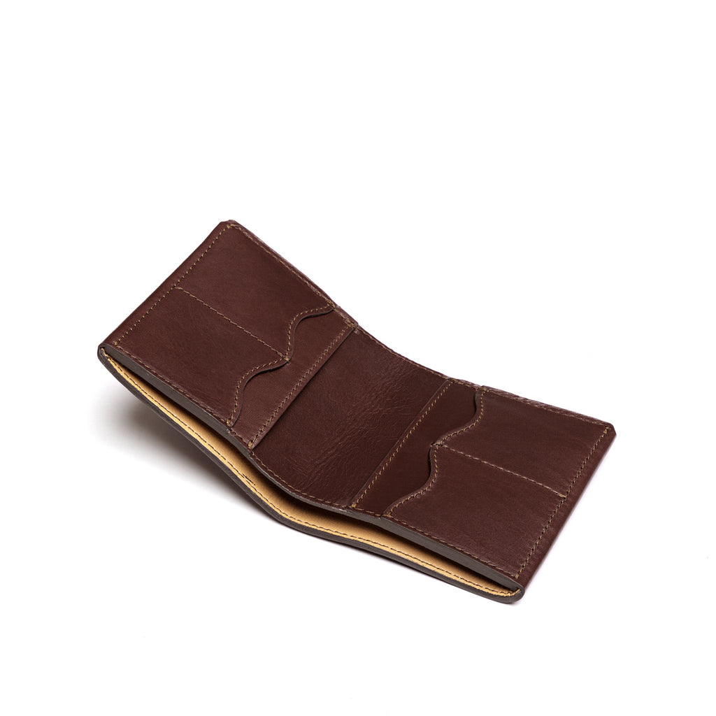 Large Bifold Wallet in Dark Coffee Brown, opened flat showing the interior card slots, angled view