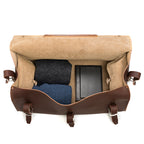 27" Adolescent Beast Duffle Bag in Chestnut, top view open with folded sweaters and black cases packed inside