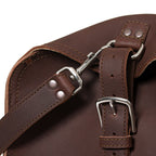 27" Adolescent Beast Duffle Bag in Chestnut, close-up of the end buckle strap and shoulder strap swivel hook