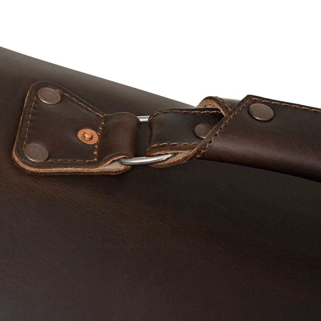 27" Adolescent Beast Duffle Bag in Dark Coffee Brown, close-up of the riveted handle anchor and D-ring