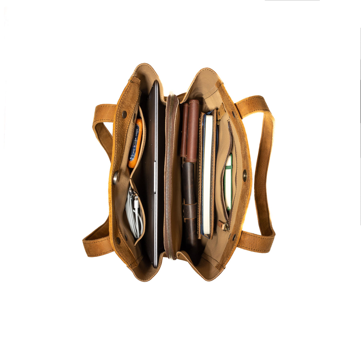 Leather Organizer Satchel in Tobacco, top-down view of the interior packed with a tablet, notebook and pens