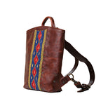 Lanita Leather Backpack in Chestnut, angled side view with woven panel and shoulder strap