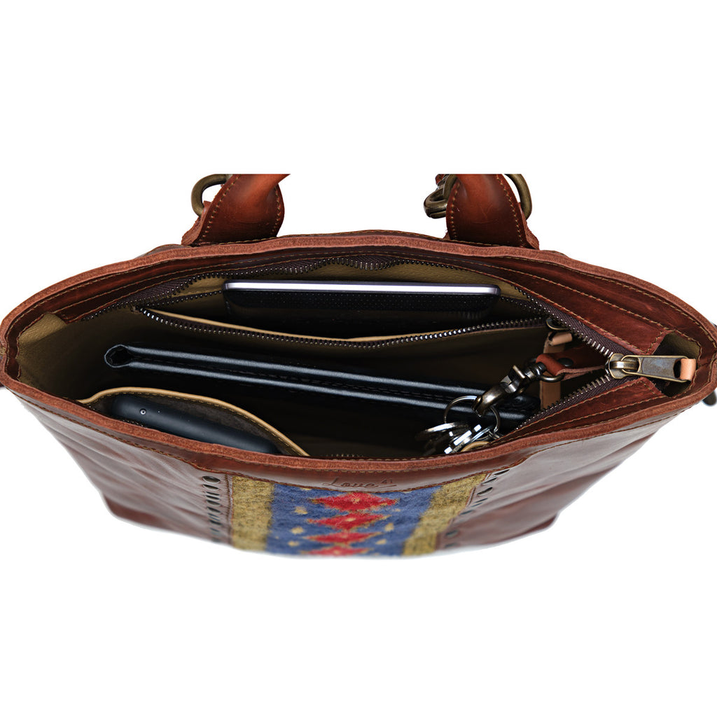 Lanita Leather Backpack in Chestnut, top-down view of unzipped interior holding a laptop and keys