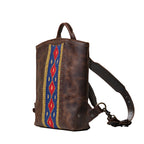 Lanita Leather Backpack in Dark Coffee Brown, angled side view with woven panel and shoulder strap