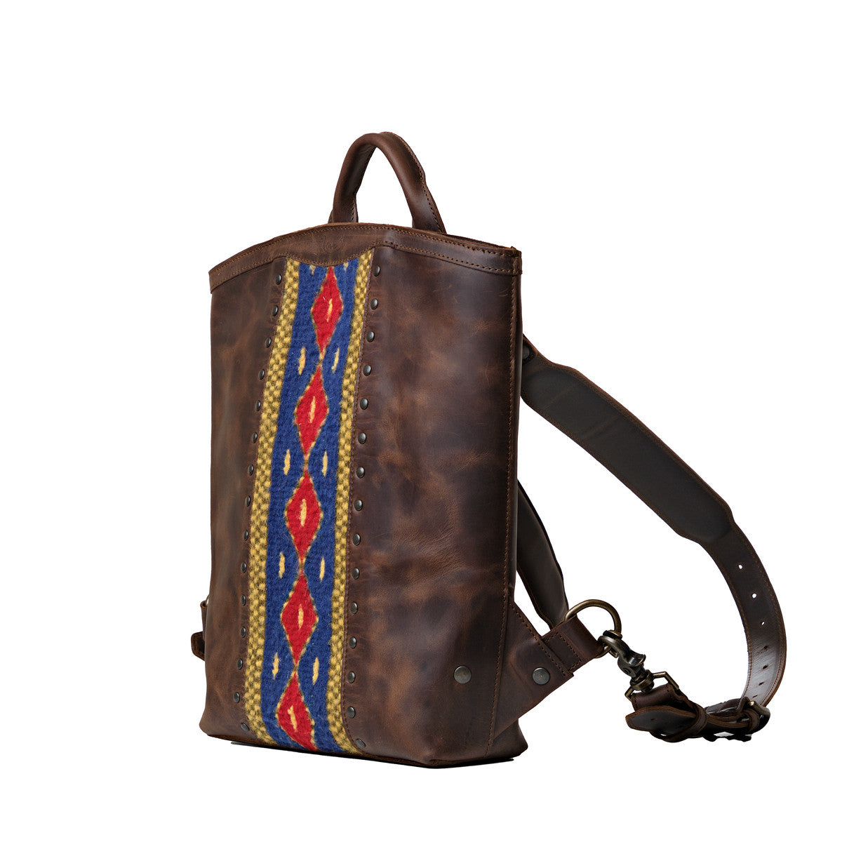 Lanita Leather Backpack in Dark Coffee Brown, angled side view with woven panel and shoulder strap