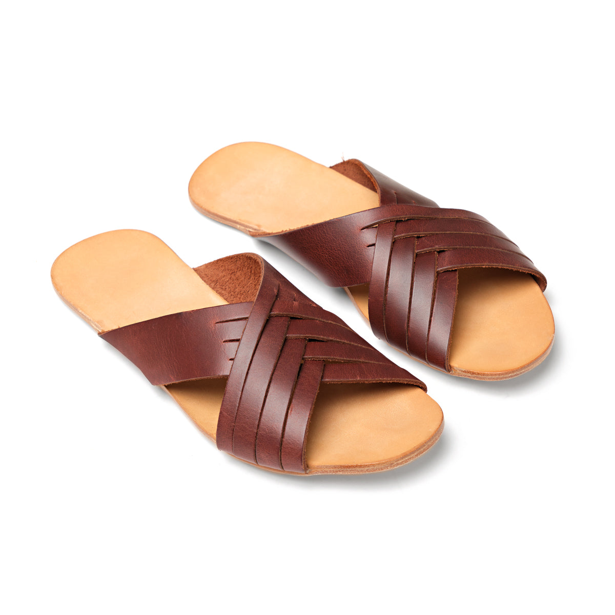 Martha Sandals in Chestnut, angled view of pair with crisscross woven straps and tan footbeds