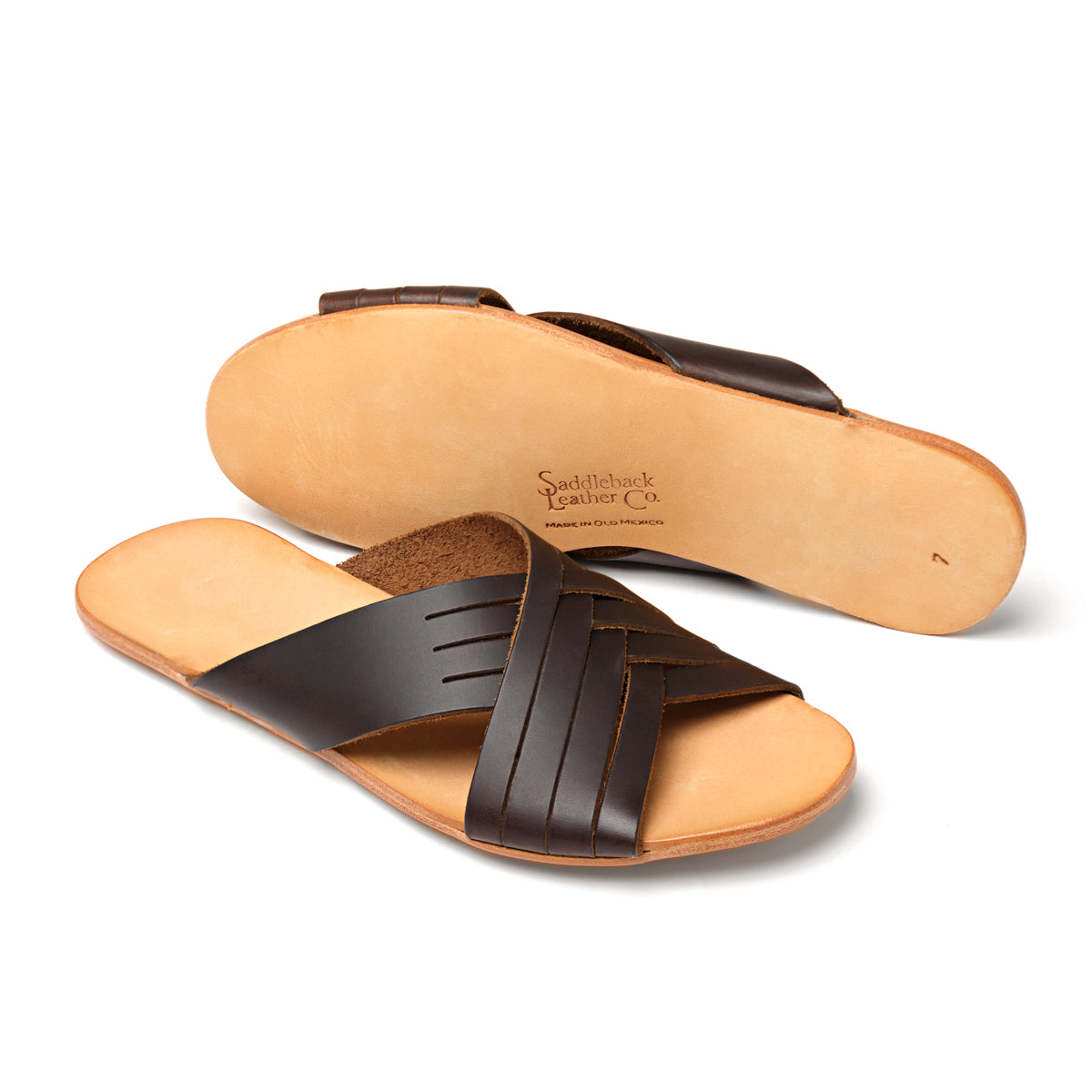 Martha Sandals in Dark Coffee Brown, one sandal upright and one showing the sole with stamped logo