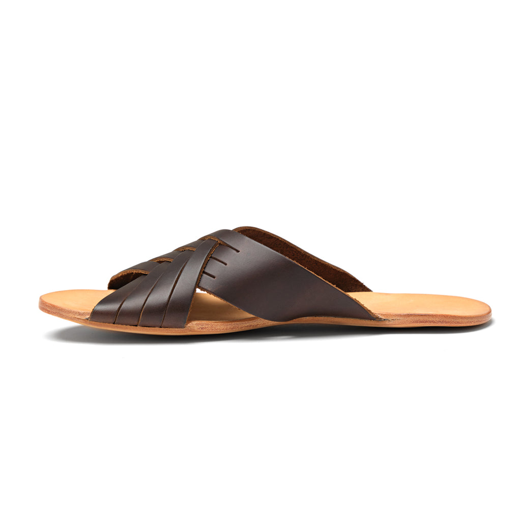Martha Sandals in Dark Coffee Brown, side profile of a single sandal with woven straps and flat sole
