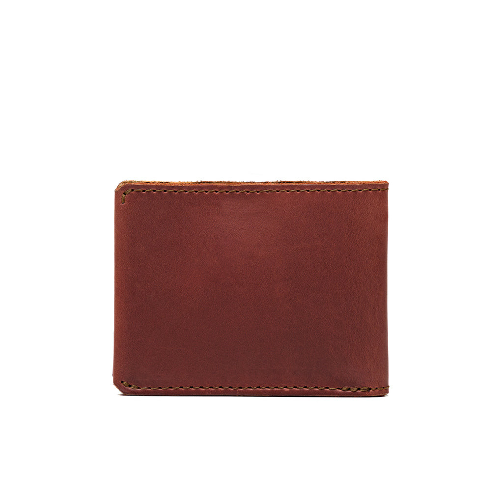 Medium Bifold Wallet in Chestnut, closed back view showing the plain leather and stitched edges