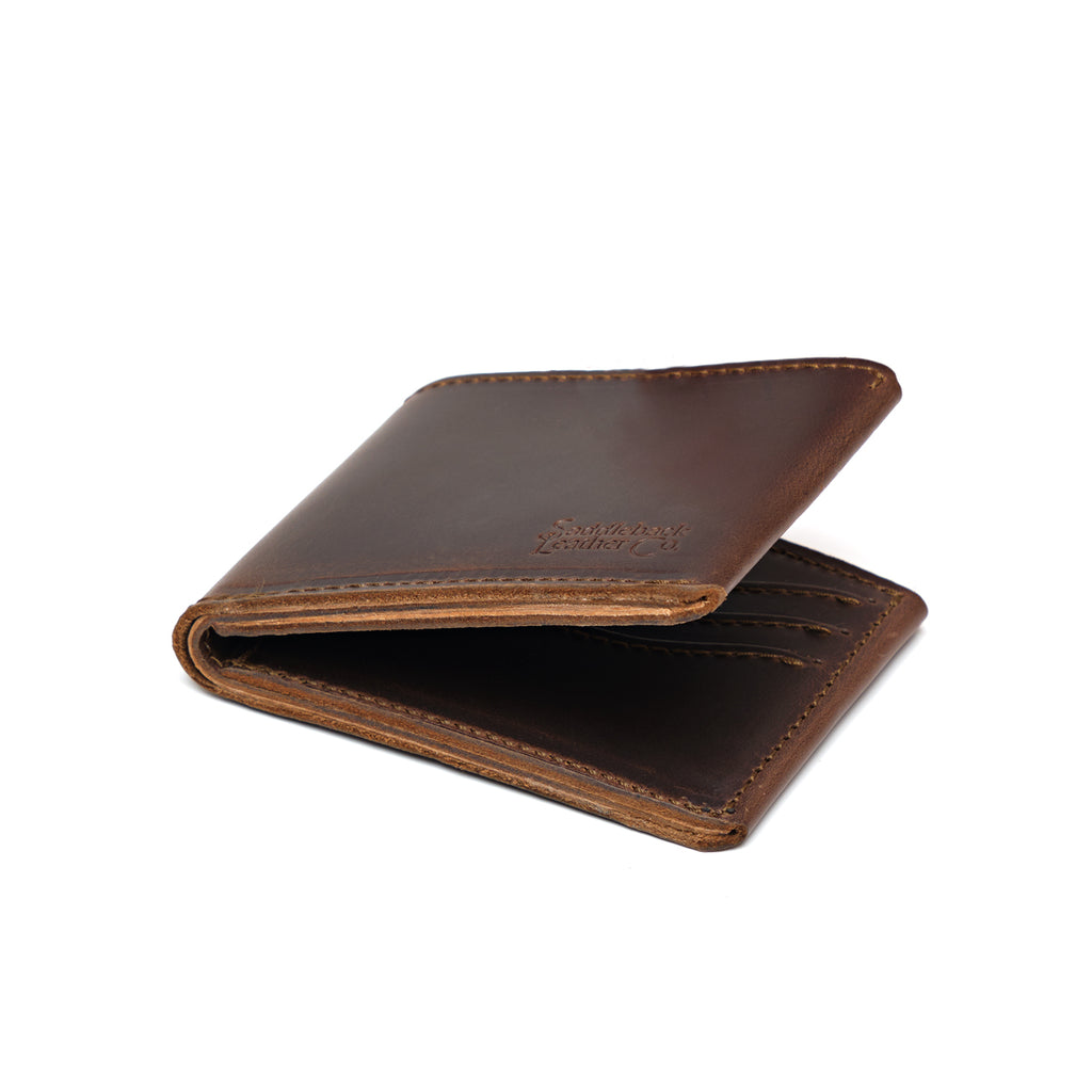 Medium Bifold Wallet in Dark Coffee Brown, angled view slightly open with embossed logo and stitched edges