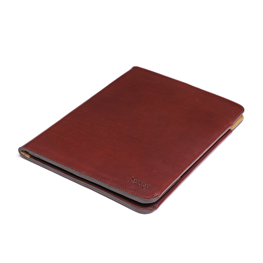 C.S. Lewis Medium Portfolio in Oxblood, closed angled view with debossed logo