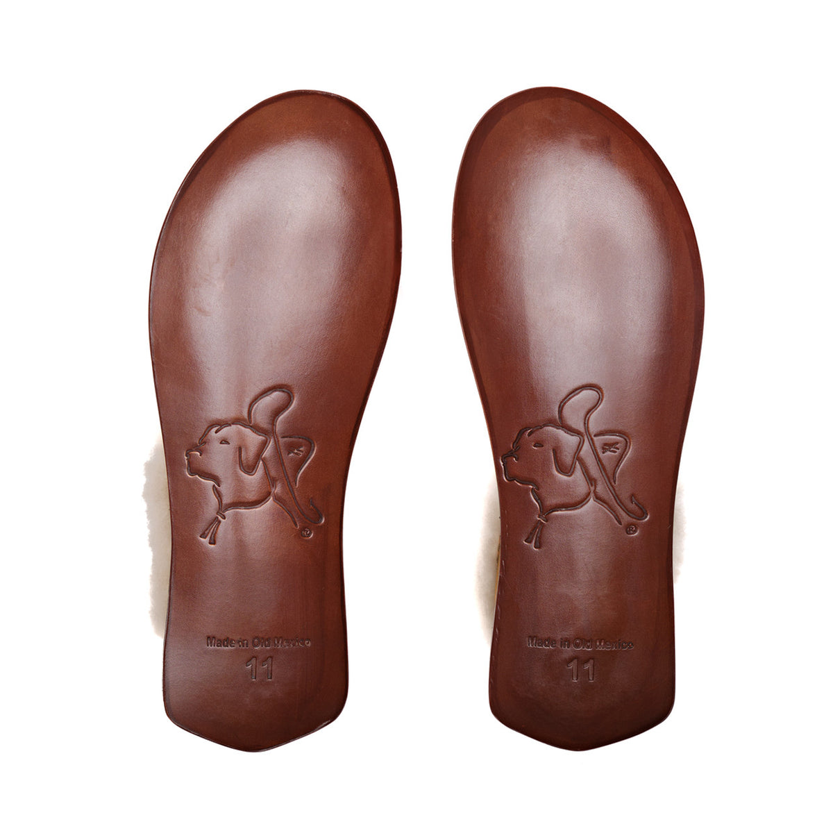 Sheepskin Moccasins in Tobacco, bottom view of the stamped leather soles