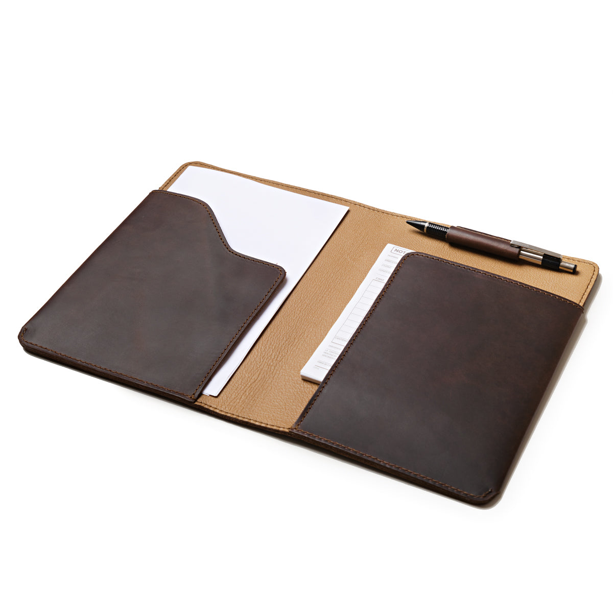 Medium Moleskin Cover in Dark Coffee Brown, open showing interior pockets with paper and a pen