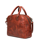 Professional Leather Satchel in Chestnut, angled side view showing the zipper and side pocket