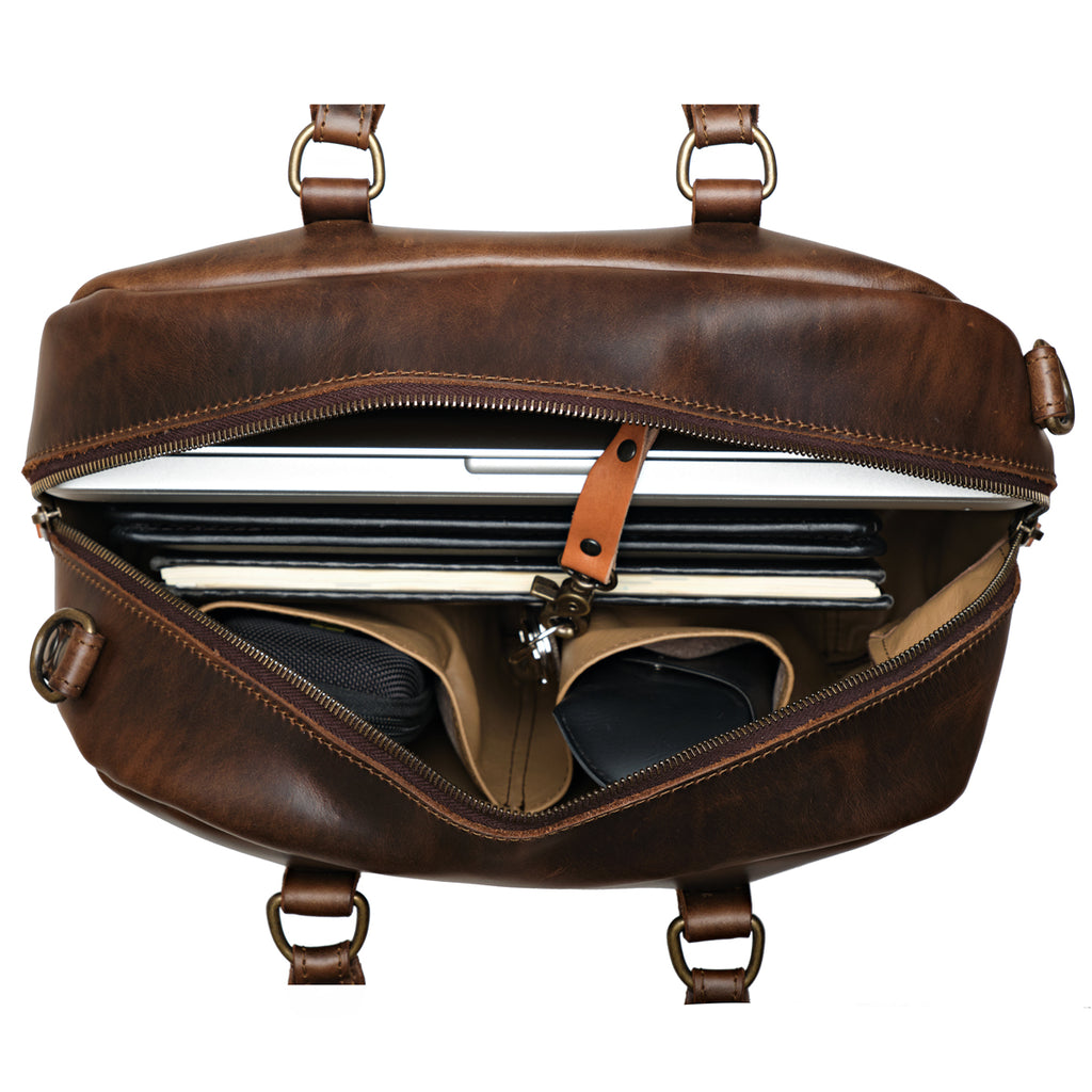 Professional Leather Satchel in Dark Coffee Brown, top view unzipped with a laptop, notebook and sunglasses inside