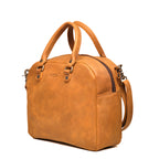 Professional Leather Satchel in Tobacco, angled side view showing the zipper and side pocket
