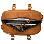 Professional Leather Satchel in Tobacco, top view unzipped with a laptop, notebook and sunglasses inside