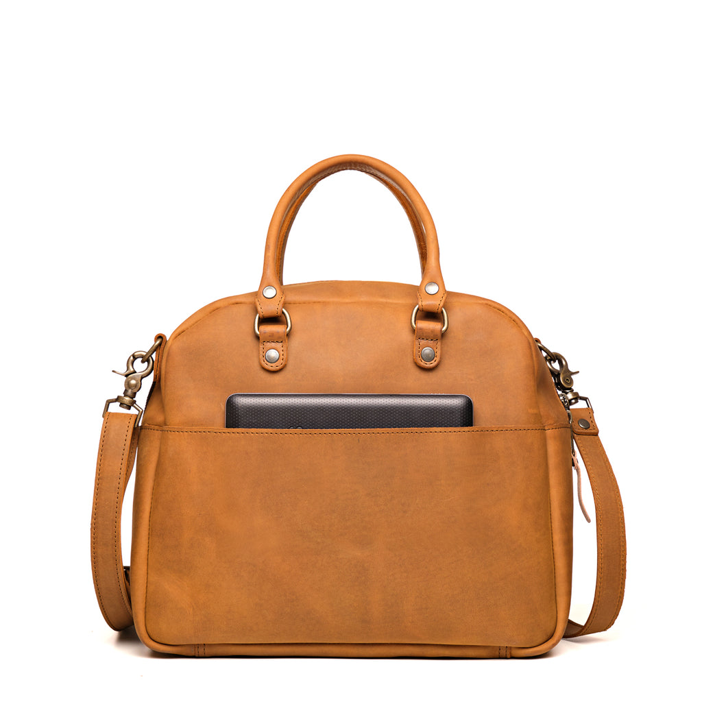 Professional Leather Satchel in Tobacco, back view with a tablet tucked in the rear slip pocket