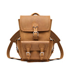 Small Front Pocket Backpack in Tobacco, front view showing the buckled flap, front pocket and shoulder straps