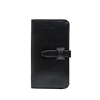 Big Wallet in Raven Black, closed front view with strap closure and debossed Saddleback Leather Co. logo