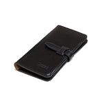 Big Wallet in Raven Black, closed angled view with strap closure and debossed logo