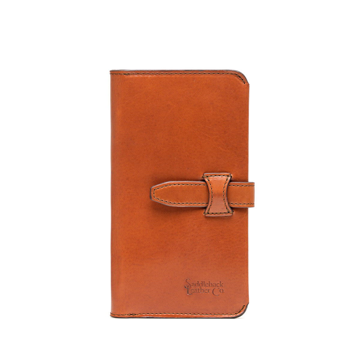 Big Wallet in English Tan, closed front view with strap closure and debossed Saddleback Leather Co. logo