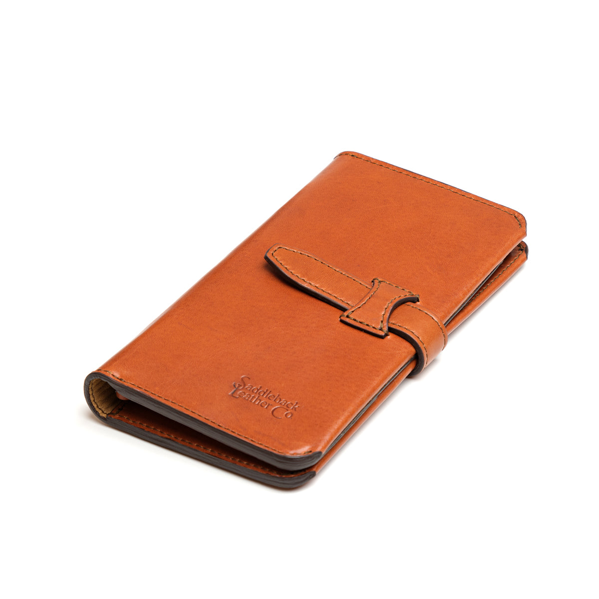Big Wallet in English Tan, closed angled view with strap closure and debossed logo