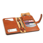 Big Wallet in English Tan, open and loaded with cards, ID, pens, cash and coins in the snap pocket