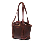 Original Tote in Chestnut, angled front view with cutout handle and buckled shoulder straps