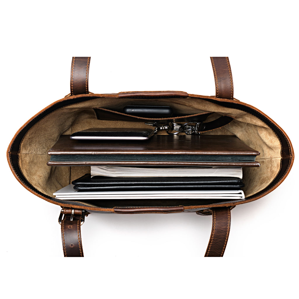 Original Tote in Dark Coffee Brown, top-down view packed with a laptop, notebooks, folders and keys