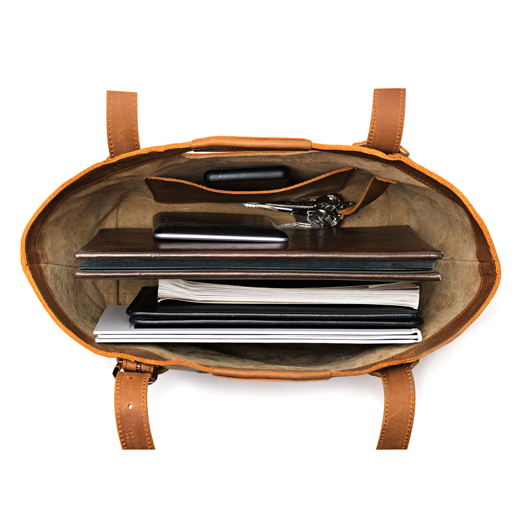 Original Tote in Tobacco, top-down view packed with a laptop, notebooks, folders and keys