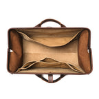 Leather Range and Tool Bag in Dark Coffee Brown, top view open and empty showing the lined interior and slip pockets