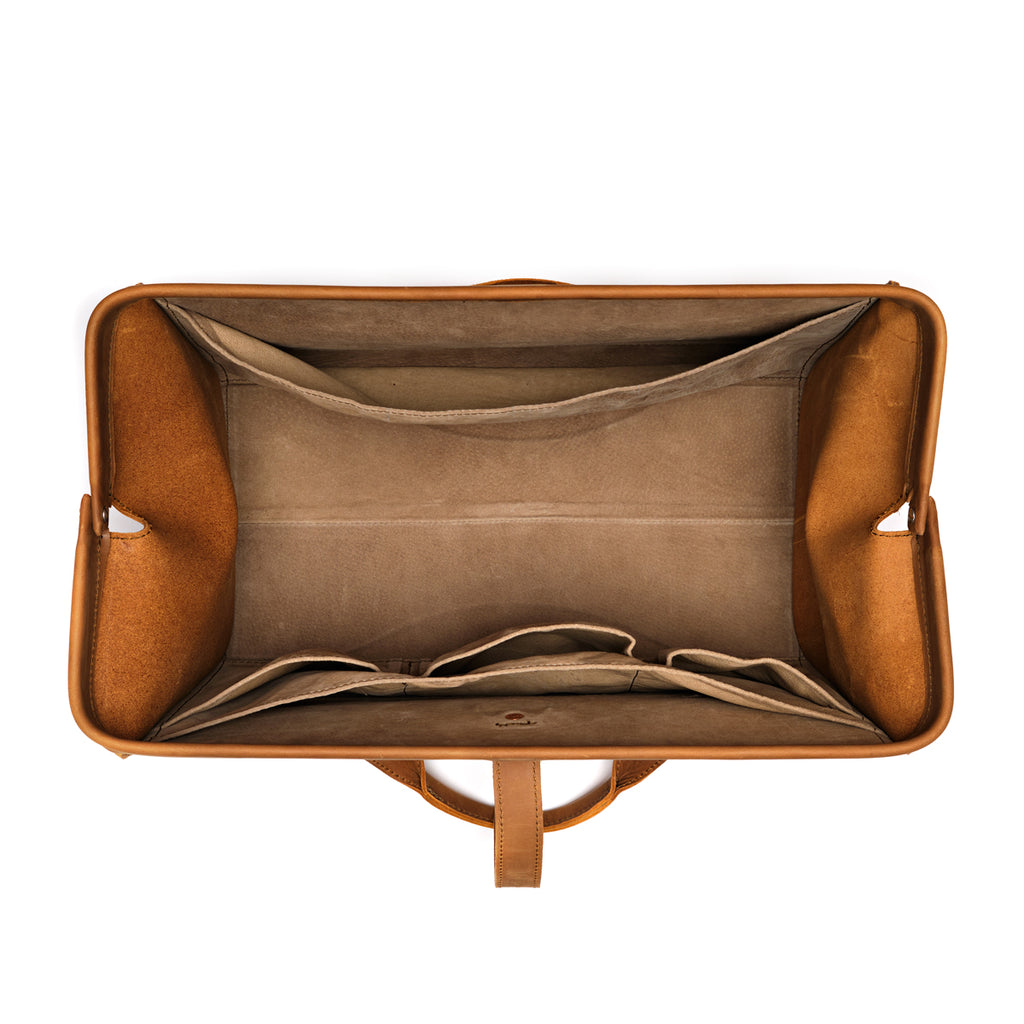 Leather Range and Tool Bag in Tobacco, top view open and empty showing the lined interior and slip pockets