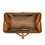 Leather Range and Tool Bag in Tobacco, top view open and empty showing the lined interior and slip pockets