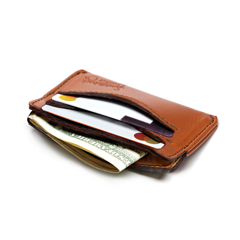 Newton Wallet in English Tan loaded with cards in the slots and folded cash in the center pocket