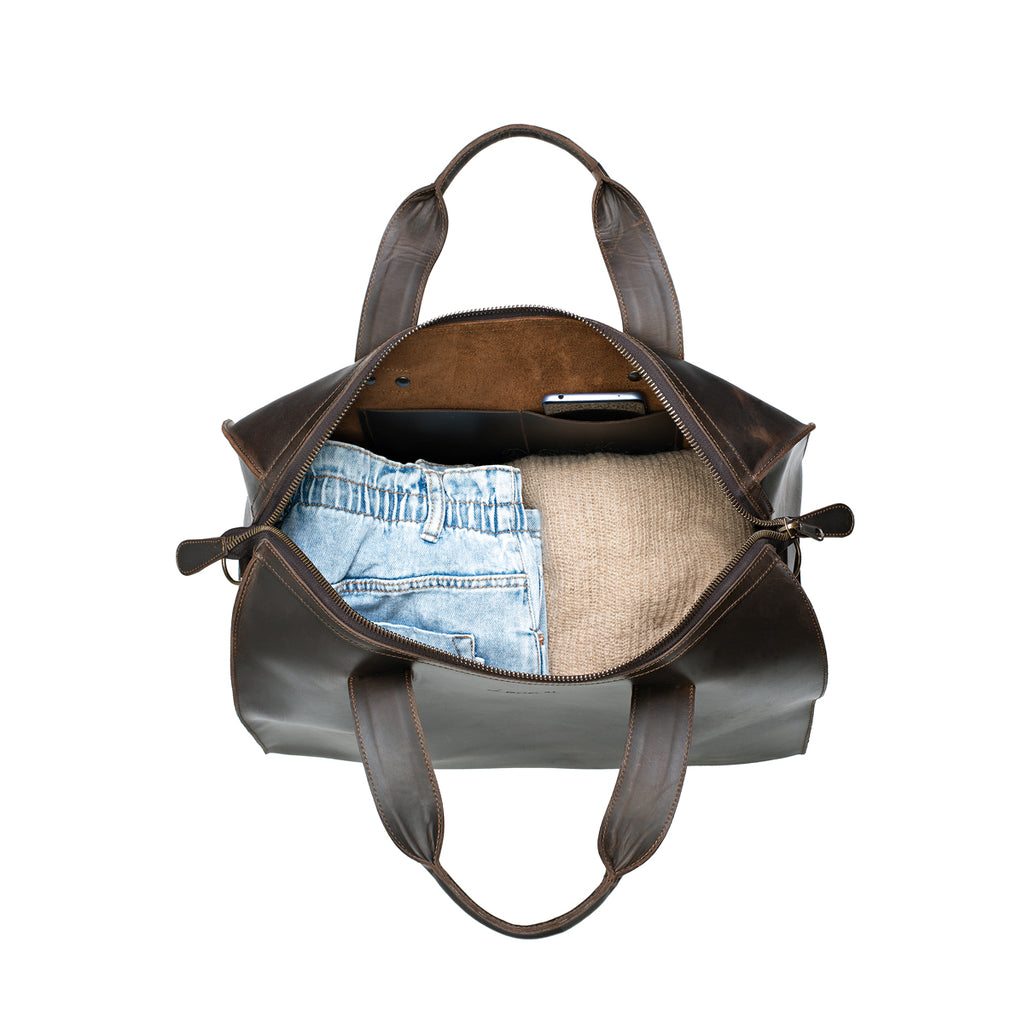 Simple Overnight Leather Duffle Bag in Dark Coffee Brown, open top packed with folded jeans and a sweater