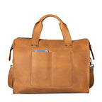 Simple Overnight Leather Duffle Bag in Tobacco, back view with exterior slip pockets holding a phone